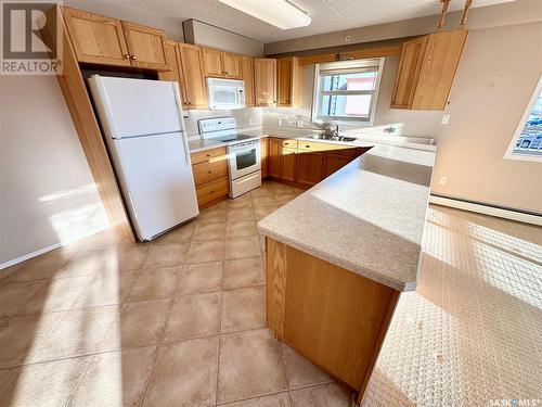 204 122 Government Road Ne, Weyburn, SK - Indoor Photo Showing Kitchen With Double Sink