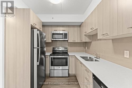 607 - 220 Cannon Street E, Hamilton, ON - Indoor Photo Showing Kitchen With Stainless Steel Kitchen With Double Sink