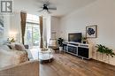 Living room with hardwood / wood-style floors and ceiling fan - 262 Dundas Street E Unit# 317, Hamilton, ON  - Indoor Photo Showing Living Room 