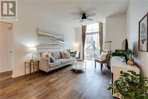 Living room with hardwood / wood-style flooring and ceiling fan - 262 Dundas Street E Unit# 317, Hamilton, ON - Indoor Photo Showing Living Room