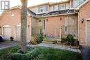 Doorway to property featuring covered porch and a garage - 79 Braeheid Avenue Avenue Unit# 6, Hamilton, ON  - Outdoor With Exterior 