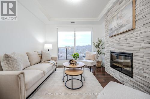 507 - 150 Wellington Street E, Guelph (Central West), ON - Indoor Photo Showing Living Room With Fireplace