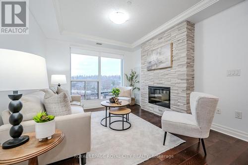 507 - 150 Wellington Street E, Guelph (Central West), ON - Indoor Photo Showing Living Room With Fireplace