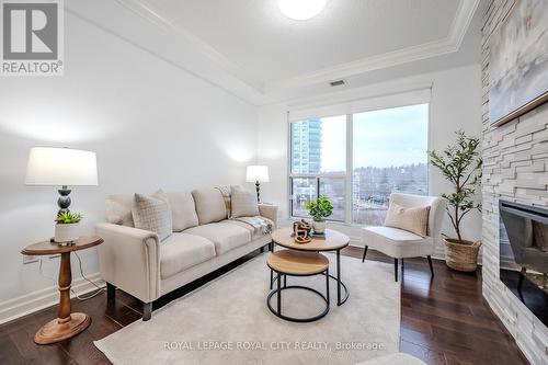 507 - 150 Wellington Street E, Guelph (Central West), ON - Indoor Photo Showing Living Room With Fireplace