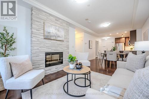 507 - 150 Wellington Street E, Guelph (Central West), ON - Indoor Photo Showing Living Room With Fireplace