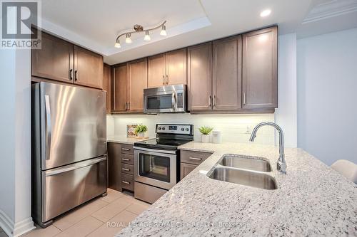 507 - 150 Wellington Street E, Guelph (Central West), ON - Indoor Photo Showing Kitchen With Stainless Steel Kitchen With Double Sink With Upgraded Kitchen