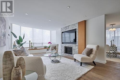 101 - 225 The Donway W, Toronto, ON - Indoor Photo Showing Living Room With Fireplace