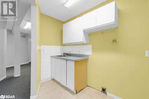 Kitchen with white cabinetry and sink - 108 Russell Street N, Madoc, ON 