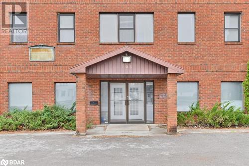 Property entrance with french doors - 108 Russell Street N, Madoc, ON 