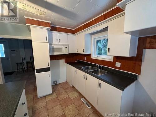 21 Mallet Street, Eel River Crossing, NB - Indoor Photo Showing Kitchen With Double Sink