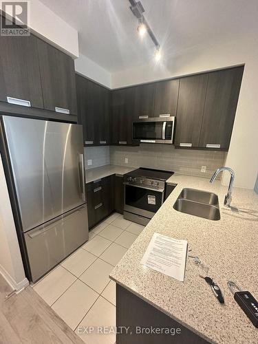 308 - 35 Watergarden Drive, Mississauga, ON - Indoor Photo Showing Kitchen With Stainless Steel Kitchen With Double Sink