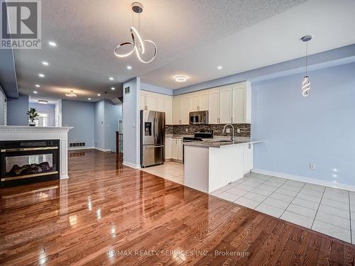 114 Rocky Point Crescent, Brampton, ON - Indoor Photo Showing Kitchen With Fireplace