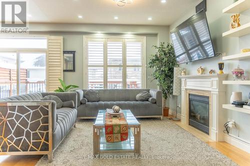 584 Pinery Trail, Waterloo, ON - Indoor Photo Showing Living Room With Fireplace