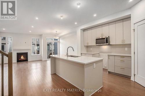 949 Cologne Street, Russell, ON - Indoor Photo Showing Kitchen With Fireplace With Double Sink