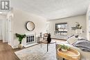 B 62 Nollet Avenue, Regina, SK  - Indoor Photo Showing Living Room With Fireplace 