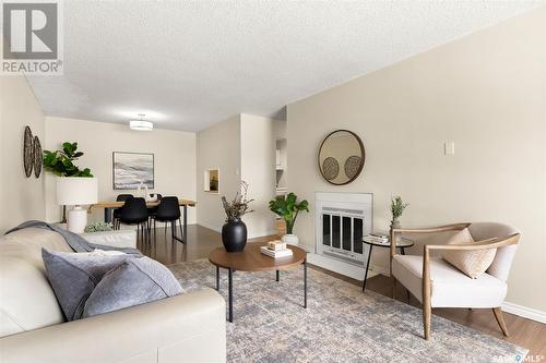 B 62 Nollet Avenue, Regina, SK - Indoor Photo Showing Living Room With Fireplace