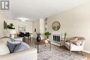 B 62 Nollet Avenue, Regina, SK  - Indoor Photo Showing Living Room With Fireplace 