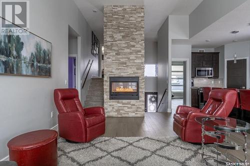 526 Gillies Cove, Saskatoon, SK - Indoor Photo Showing Living Room With Fireplace