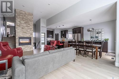 526 Gillies Cove, Saskatoon, SK - Indoor Photo Showing Living Room With Fireplace