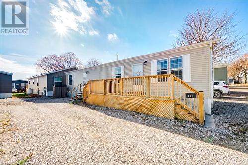 View of front of home with a wooden deck - 99 Fourth Conc Road, Burford, ON - Outdoor