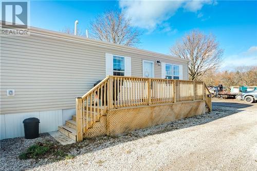 Property entrance featuring a wooden deck - 99 Fourth Conc Road, Burford, ON - Outdoor