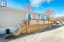 Property entrance featuring a wooden deck - 