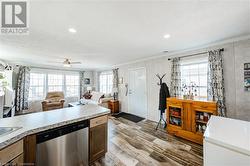 Kitchen with ornamental molding, stainless steel dishwasher and ceiling fan. - 