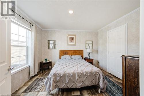 Bedroom featuring hardwood / wood-style flooring and ornamental molding - 99 Fourth Conc Road, Burford, ON - Indoor Photo Showing Bedroom