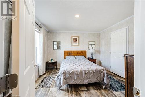 Bedroom featuring hardwood and ornamental molding - 99 Fourth Conc Road, Burford, ON - Indoor Photo Showing Bedroom