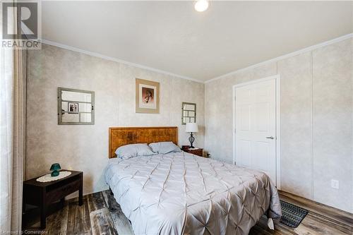 Bedroom with crown molding and wood-type flooring - 99 Fourth Conc Road, Burford, ON - Indoor Photo Showing Bedroom