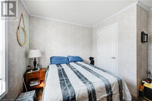 Bedroom with dark hardwood and crown molding - 99 Fourth Conc Road, Burford, ON - Indoor Photo Showing Bedroom