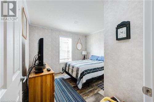 Bedroom featuring hardwood and ornamental molding - 99 Fourth Conc Road, Burford, ON - Indoor Photo Showing Bedroom