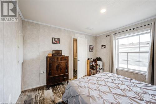 Bedroom with crown molding and hardwood / wood-style flooring - 99 Fourth Conc Road, Burford, ON - Indoor Photo Showing Bedroom