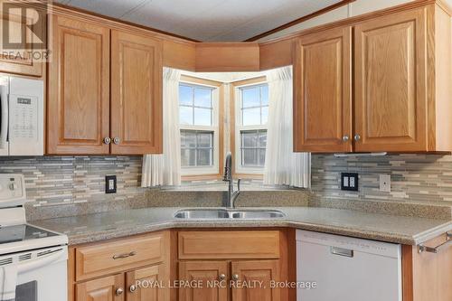 #248 - 3033 Townline Road, Fort Erie (327 - Black Creek), ON - Indoor Photo Showing Kitchen With Double Sink