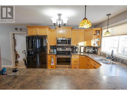 12286 242 Road, Fort St. John, BC - Indoor Photo Showing Kitchen With Double Sink