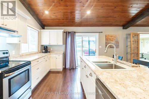 328 Peek-A-Boo Trail, Tiny, ON - Indoor Photo Showing Kitchen With Double Sink