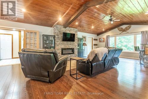 328 Peek-A-Boo Trail, Tiny, ON - Indoor Photo Showing Living Room With Fireplace