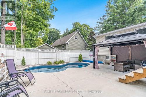 328 Peek-A-Boo Trail, Tiny, ON - Outdoor With In Ground Pool With Deck Patio Veranda