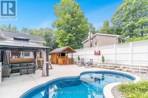 328 Peek-A-Boo Trail, Tiny, ON - Outdoor With In Ground Pool With Deck Patio Veranda