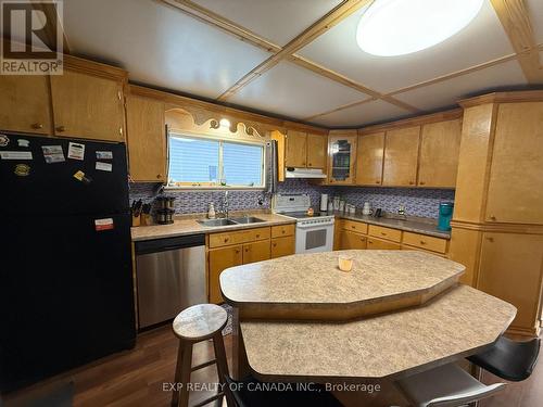 384 Commercial Avenue, Timmins, ON - Indoor Photo Showing Kitchen With Double Sink