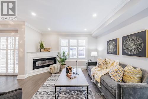 3 Delight Way, Whitby, ON - Indoor Photo Showing Living Room With Fireplace