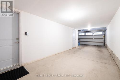 Tandem Garage 2 Car Parking - 36 - 26 Lunar Crescent, Mississauga (Streetsville), ON - Indoor Photo Showing Garage