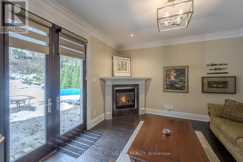 DEN WITH FIREPLACE & WALK OUT TO PATIO - 17 - 145 Base Line Road E, London, ON - Indoor Photo Showing Living Room With Fireplace