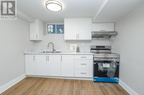 7010 Dunn Street, Niagara Falls, ON - Indoor Photo Showing Kitchen With Double Sink