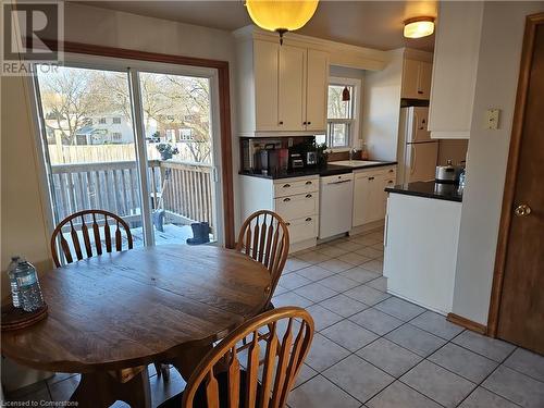 Tiled dining area with plenty of natural light and sink - 140 Alvin Street, Waterloo, ON - Indoor