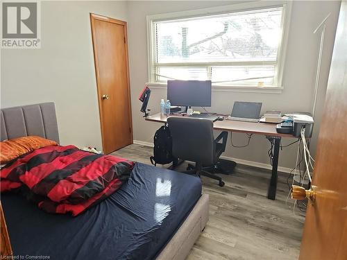 Bedroom featuring light hardwood / wood-style floors and multiple windows - 140 Alvin Street, Waterloo, ON - Indoor Photo Showing Office