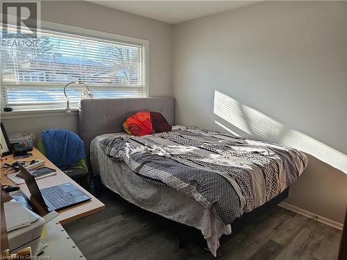 Bedroom with dark hardwood / wood-style floors - 140 Alvin Street, Waterloo, ON - Indoor Photo Showing Bedroom