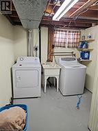 Laundry area with separate washer and dryer - 