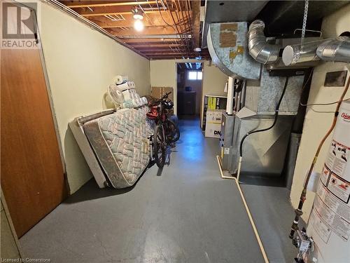 Basement featuring water heater - 140 Alvin Street, Waterloo, ON - Indoor Photo Showing Basement