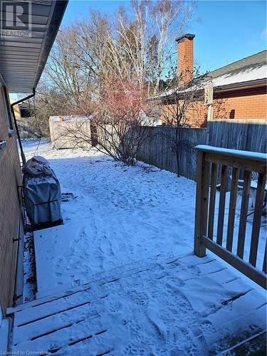 View of snowy yard - 140 Alvin Street, Waterloo, ON - Outdoor With Deck Patio Veranda